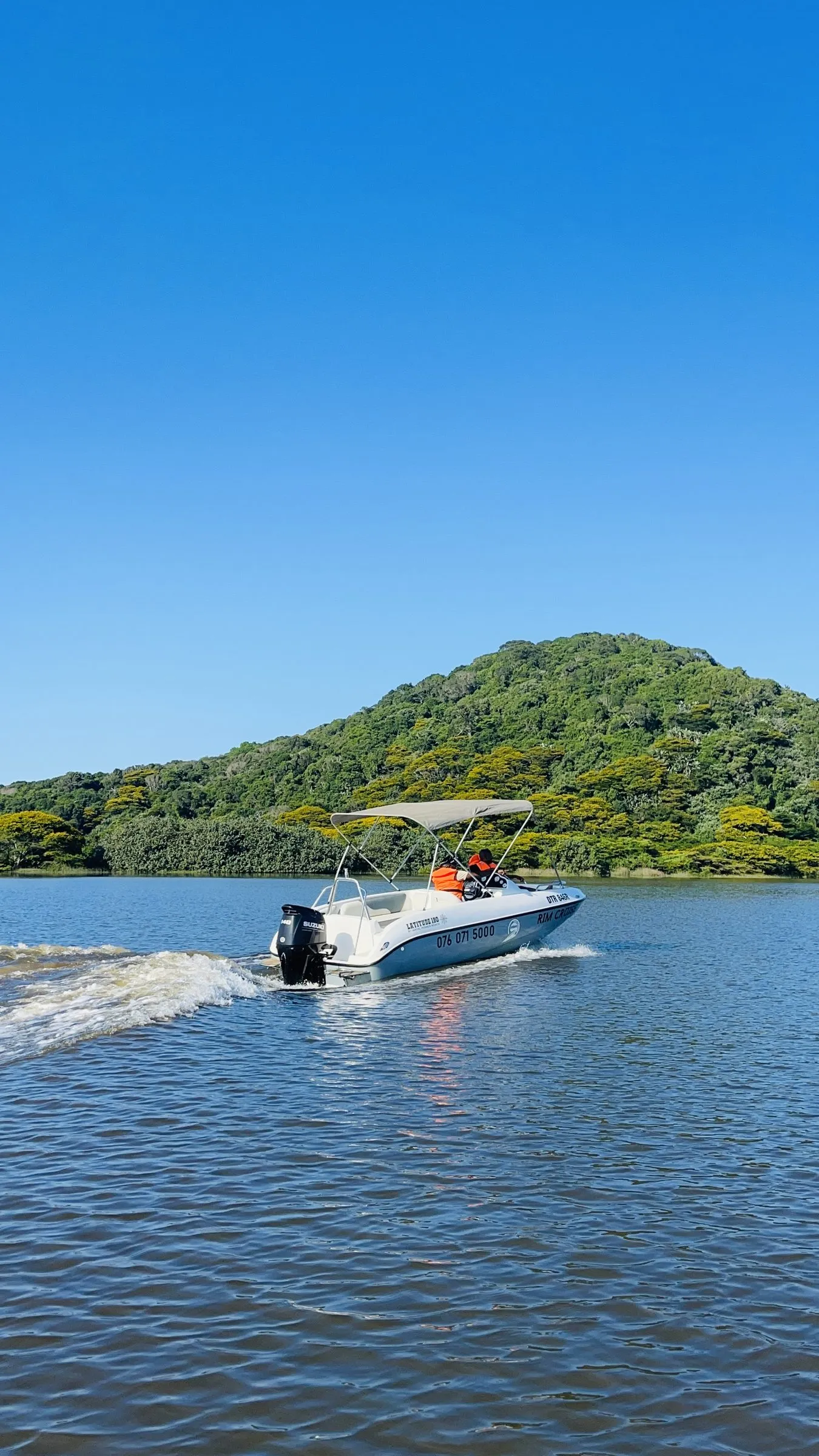 The Rim Cruise boat under a clear blue sky