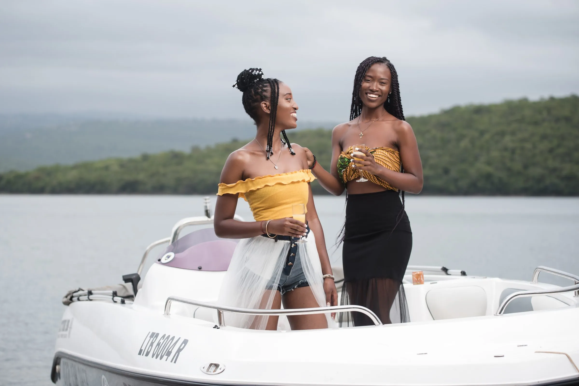 Two friends standing on the deck of the boat
